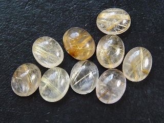Rutile Quartz 10 x 8 mm - golden needles - oval cabochon
