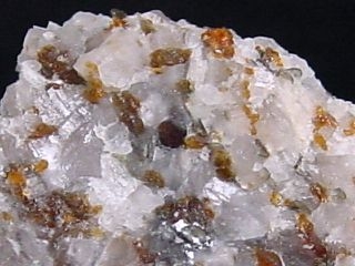Norbergite specimen 21 mm - brown spots - Karelia Russia