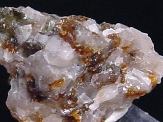 Norbergite specimen 16 mm - brown spots - Karelia Russia