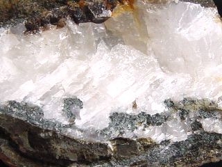 Pumpellyite specimen 48 mm - Medvezhyi, Norilsk, Russia