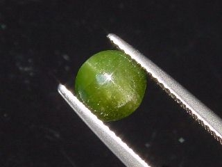 Kornerupine Catseye 1,57 Ct. round cabochon Sri Lanka
