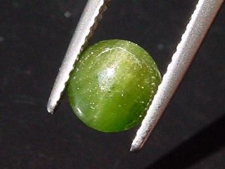 Kornerupine Catseye 1,57 Ct. round cabochon Sri Lanka