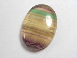 Fluorite 74,40 Ct. multicolor banded oval cabochon