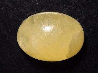 Calcite 24,55 Ct. yellow - oval cabochon - Brazil