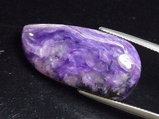 Charoite 23,77 Ct. fine fancy cabochon - Jakutia, Russia