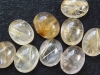 Rutile Quartz 10 x 8 mm - golden needles - oval cabochon