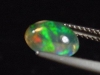 Fire Opal 1,25 Ct. fine colorplay - oval cabochon Mexico