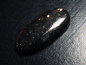 Preview: Bronzite 28,77 Ct. oval cabochon with fine shimmer