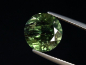 Preview: Peridot mit dekorativen Einschlüssen 6,03 Ct. Rund 11 mm Pak.