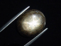 Preview: Sternsaphir 21,31 Ct. schwarz golden 17 x 14 mm Oval Cabochon