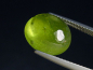 Preview: Peridot 6,58 Ct. - Apfelgrün - 12 x 10 mm Oval Cabochon