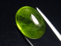 Preview: Peridot 12,80 Ct. - Apfelgrün - 15 x 11 mm Oval Cabochon