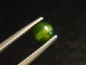 Preview: Diopsid Katzenauge 0,70 Ct. grün Rund Cabochon - Merelani, Tansania