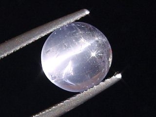 Petschite / violet Skapolite cat's eye 2,28 Ct. round cabochon Tanzania