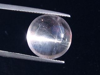 Skapolite cat's eye 10,22 Ct. colorless round cabochon Tanzania