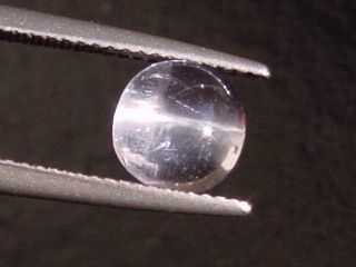 Petschite / violet Skapolite cat's eye 1,70 Ct. round cabochon Tanzania
