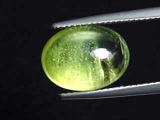 Peridot 8,55 Ct. - apple green - 13,5 x 10 mm oval cabochon