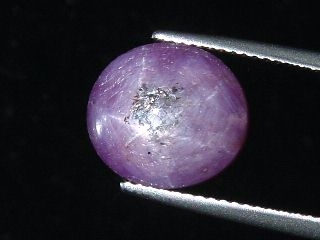 Star Ruby 11,89 Ct. - good star effect - oval cabochon