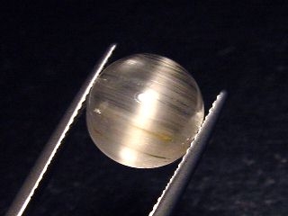 Topaz cat's eye 8,26 Ct. rare round cabochon - Minas Gerais, Brazil