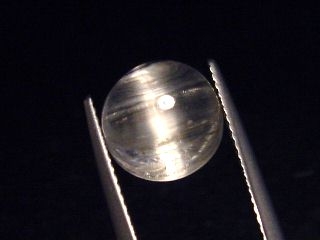 Topaz cat's eye 5,80 Ct. rare round cabochon - Minas Gerais, Brazil