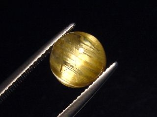 Rutile Quartz cat's eye 4,19 Ct. round cabochon - Minas Gerais, Brazil