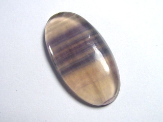 Colorchange Fluorite 28,74 Ct. green to purple cabochon