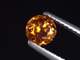 Preview: Spessartit Granat 0,68 Ct. leuchtend orange 5 mm Rund Tansania