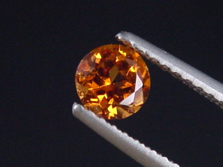Preview: Spessartit Granat 0,57 Ct. leuchtend orange 4,5 mm Rund Tansania