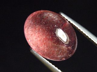 Lepidocrocite in Quartz 6,56 Ct. cabochon