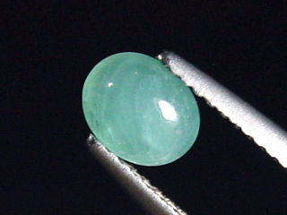 Preview: Grandidierit 0,79 Ct. selten Oval Cabochon Andrahomana, Madag.