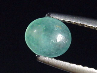 Grandidierit 0,70 Ct. selten Oval Cabochon Andrahomana, Madag.