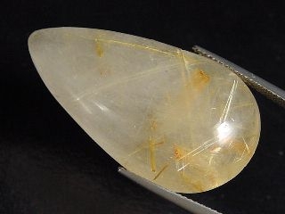 Rutile Quartz 47,92 Ct. fine golden needles pear cabochon