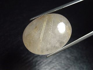 Rutile Quartz 27,81 Ct. golden Rutile needles oval cabochon