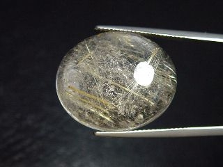 Rutile Quartz 31,77 Ct. golden Rutile needles oval cabochon