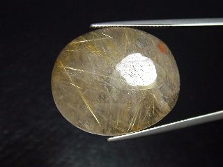 Rutile Quartz 35,58 Ct. golden Rutile needles oval cabochon