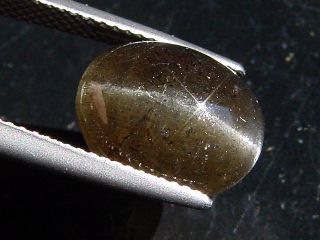 Sillimanite cat's eye 6,07 Ct. oval cabochon Sri Lanka