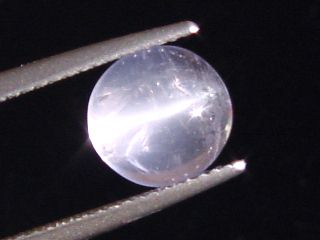 Petschite / violet Skapolite cat's eye 2,28 Ct. round cabochon Tanzania