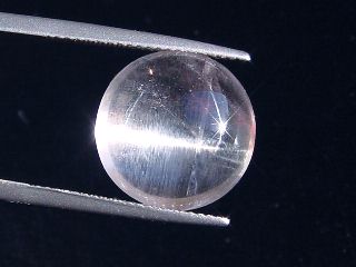 Skapolite cat's eye 10,22 Ct. colorless round cabochon Tanzania
