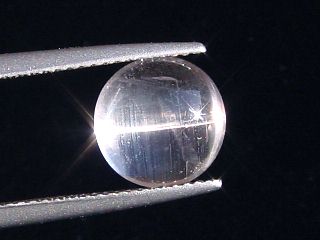 Skapolite cat's eye 3,52 Ct. colorless round cabochon Tanzania