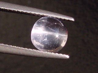 Petschite / violet Skapolite cat's eye 1,70 Ct. round cabochon Tanzania