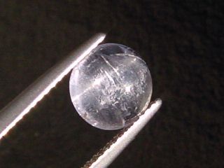 Petschite / violet Skapolite cat's eye 1,64 Ct. round cabochon Tanzania