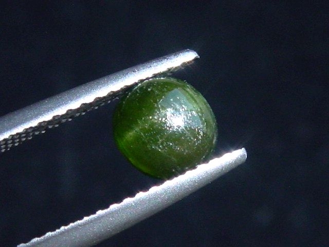 Kornerupine cat's eye 1,11 Ct. round cabochon Sri Lanka