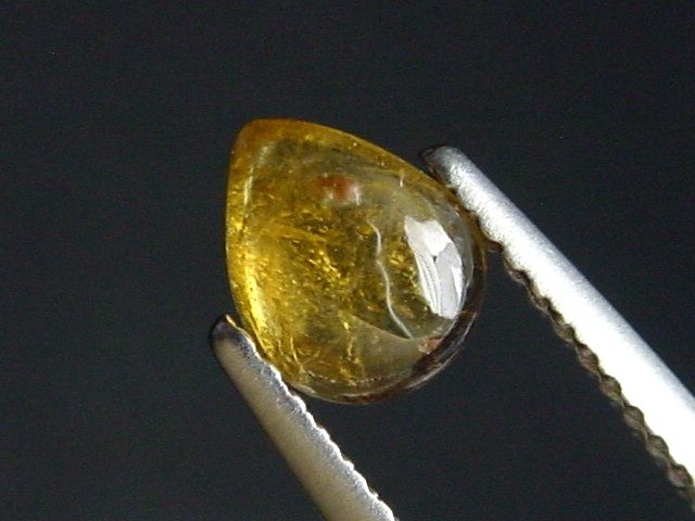 Dravite Tourmaline 0,77 Ct. pear cabochon Brazil