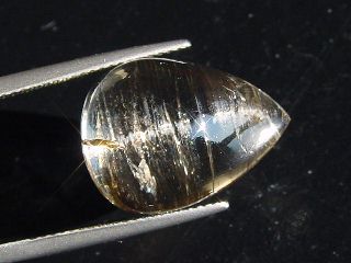Skapolite cat's eye 15,78 Ct. brown pear cabochon Tanzania