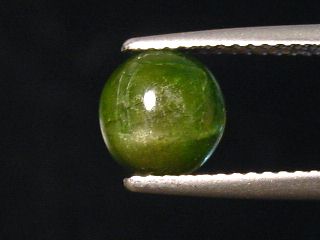 Kornerupine Catseye 1,64 Ct. round cabochon Sri Lanka