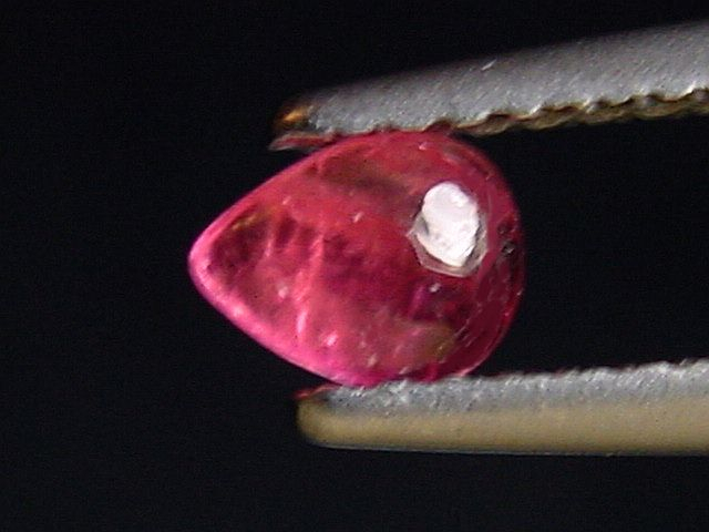 Pezzottaite 0,33 Ct. pear cabochon - rare Madagascar