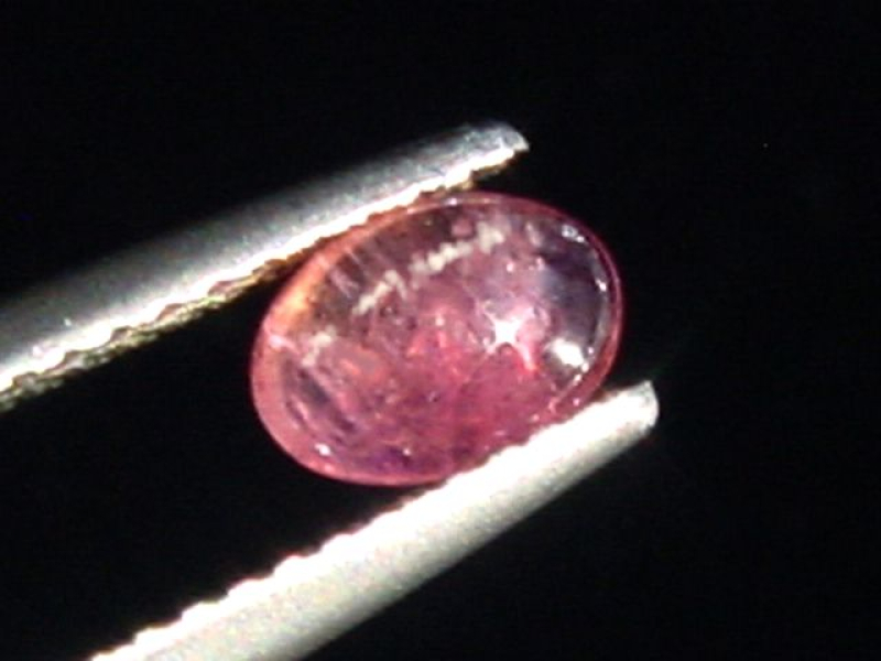 Pezzottait Katzenauge 0,58 Ct. Oval Cabochon - selten Madag.