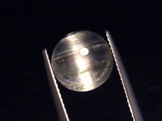Topaz cat's eye 5,80 Ct. rare round cabochon - Minas Gerais, Brazil