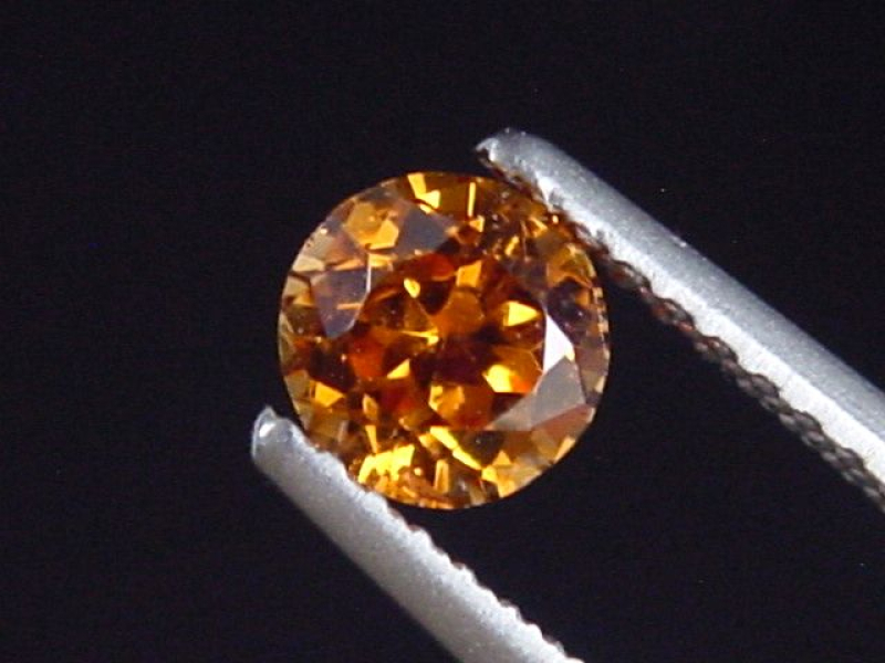 Spessartit Granat 0,58 Ct. leuchtend orange 5 mm Rund Tansania