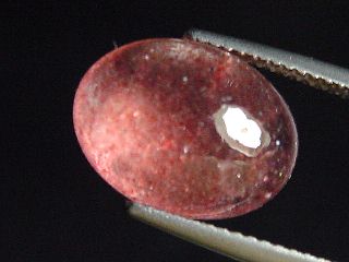 Lepidocrocite in Quartz 6,56 Ct. cabochon